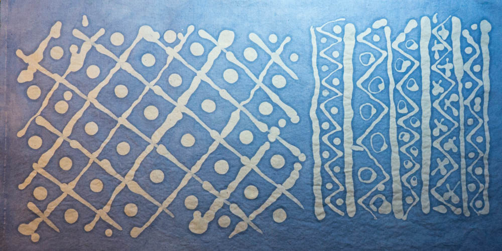 experiment with wax resist batik and indigo dye